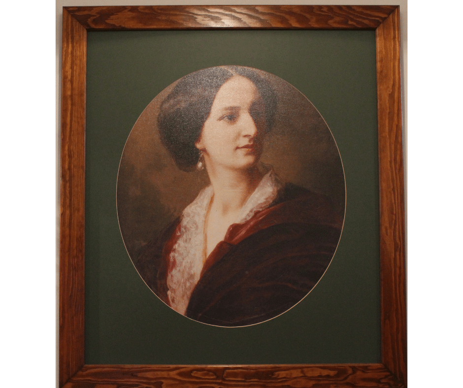 Owalny portret urodziwej Elizy  umieszczony na zielonym tle i zamknięty w drewnianych ramach obrazu.